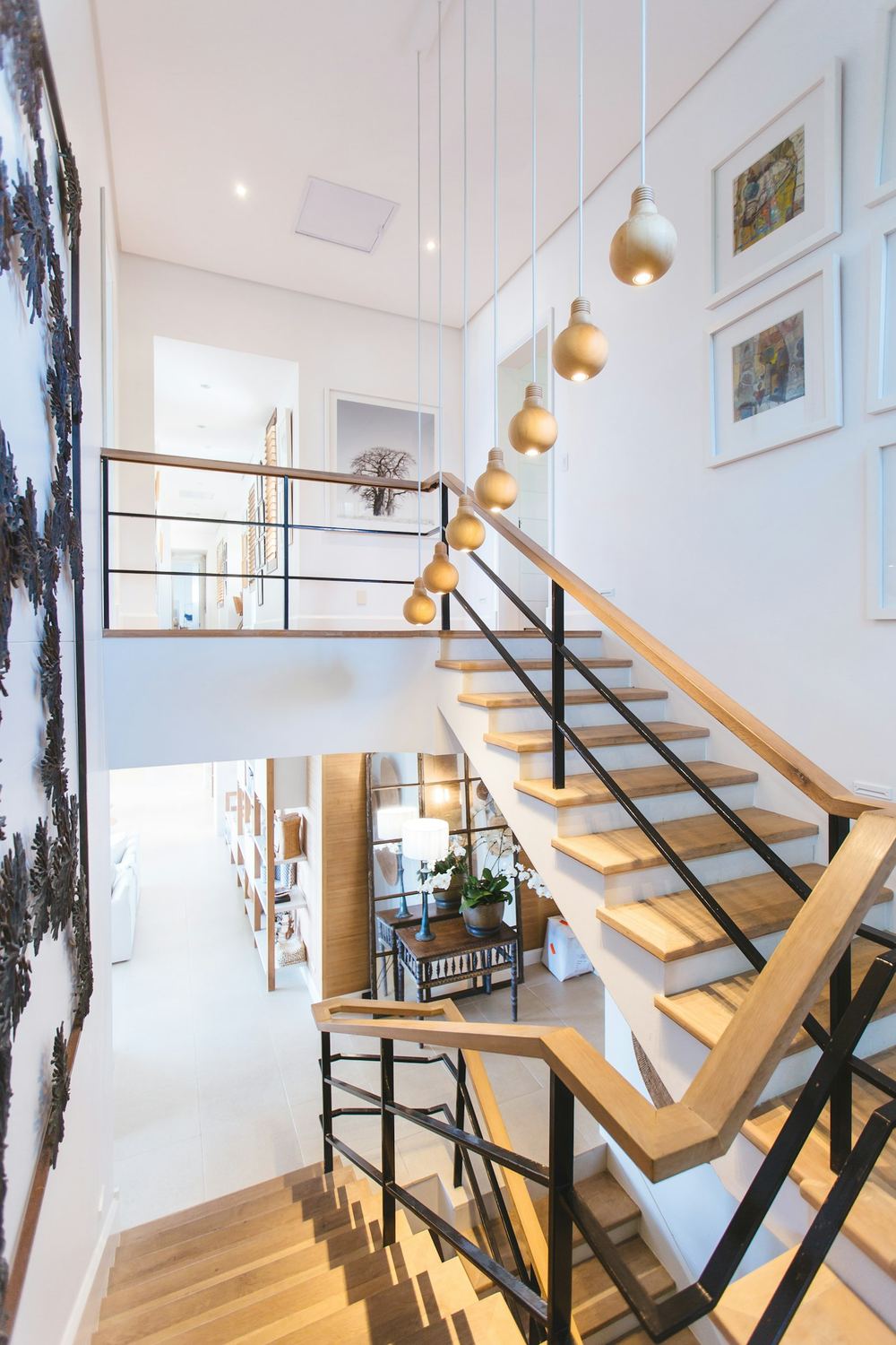Sculptural timber staircase in a double-height hall